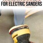A hand holds a yellow electric sander with a foam sanding pad against a curved wooden surface.