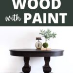 A dark-stained round wood table with decor, under text: How to stain wood with paint.