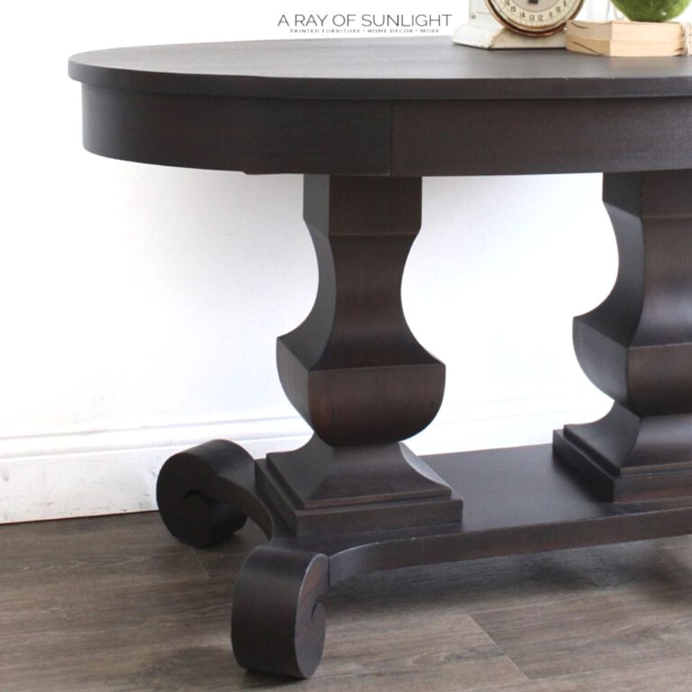 closeup of empire style table painted with black paint