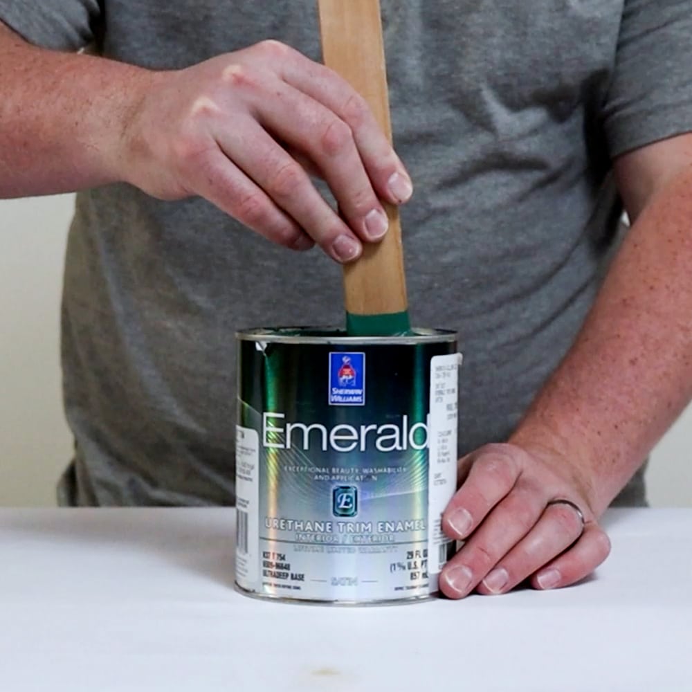 stirring of green paint in can 