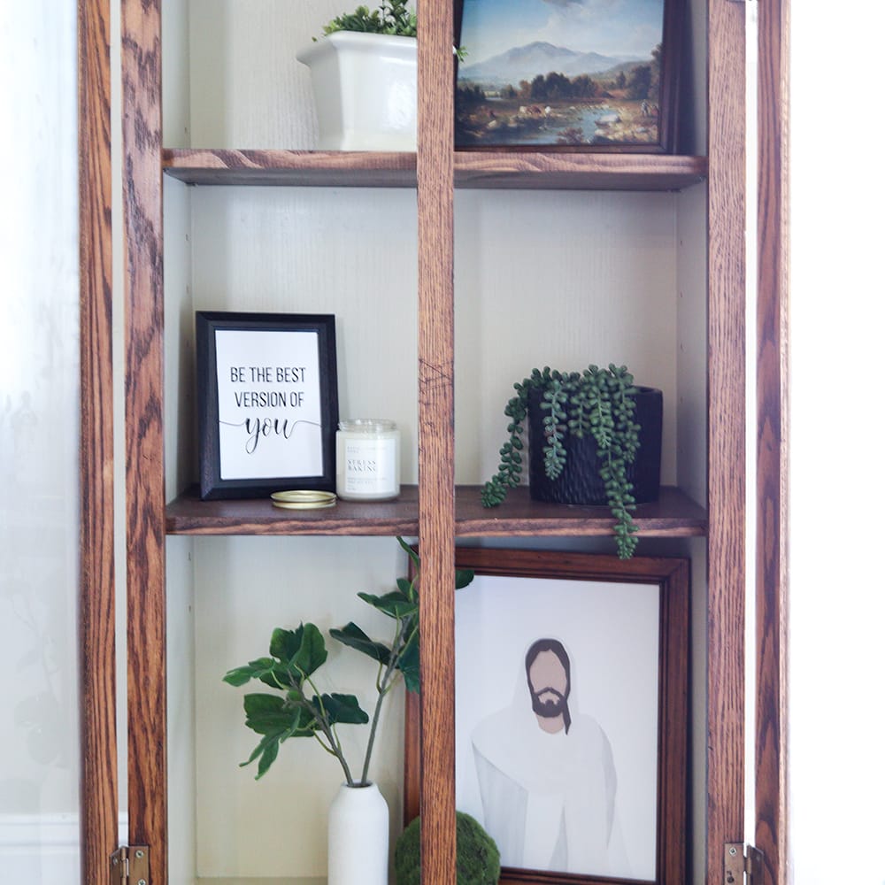 photo of stained frames showcased in a glass cabinet