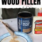 Open can of wood stain, wood glue, and wood filler mixed on a paper plate with a stick.