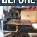 A worn, dark wood two-tiered table with BEFORE written in large letters above it.