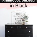Black farmhouse dresser with white knobs, a plant, and a clock on top, under a sign with an inspirational quote.