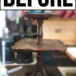 A worn, dark wood two-tiered table with scuffed surfaces and BEFORE text above it.