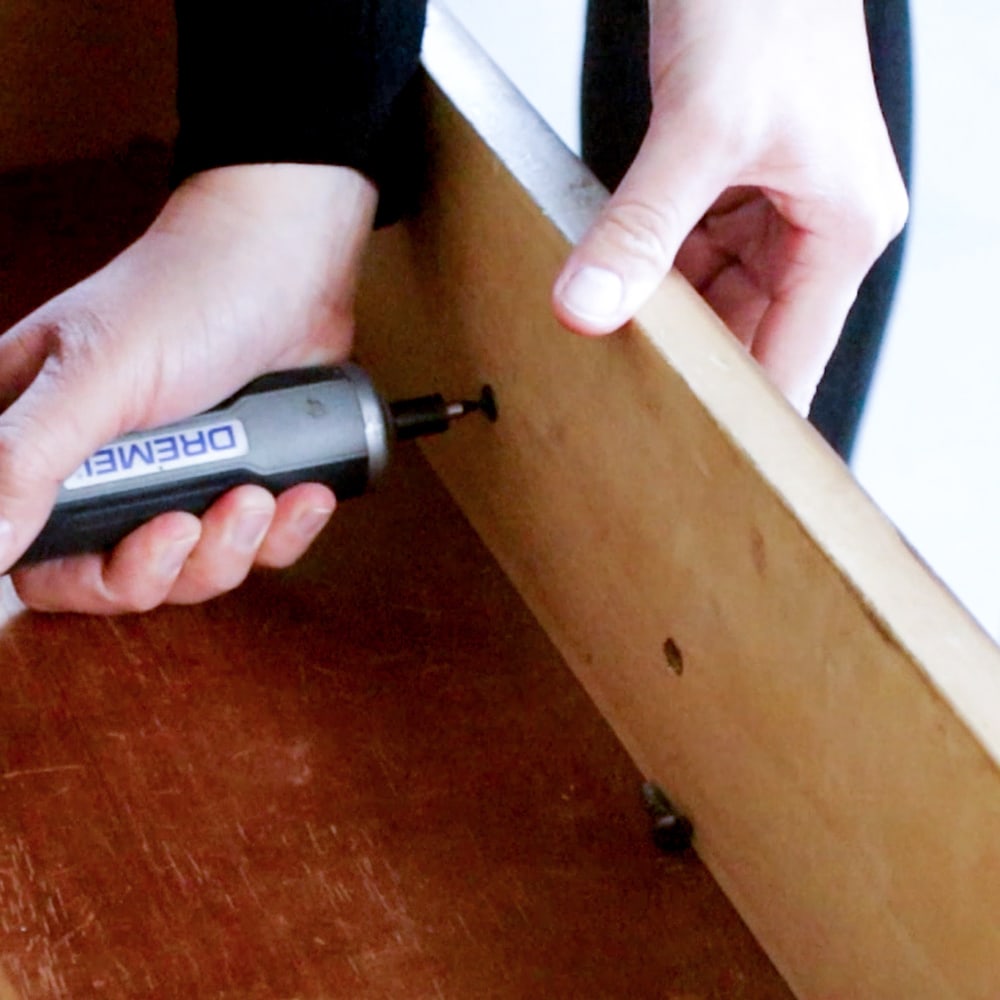removing furniture hardware using electric screwdriver