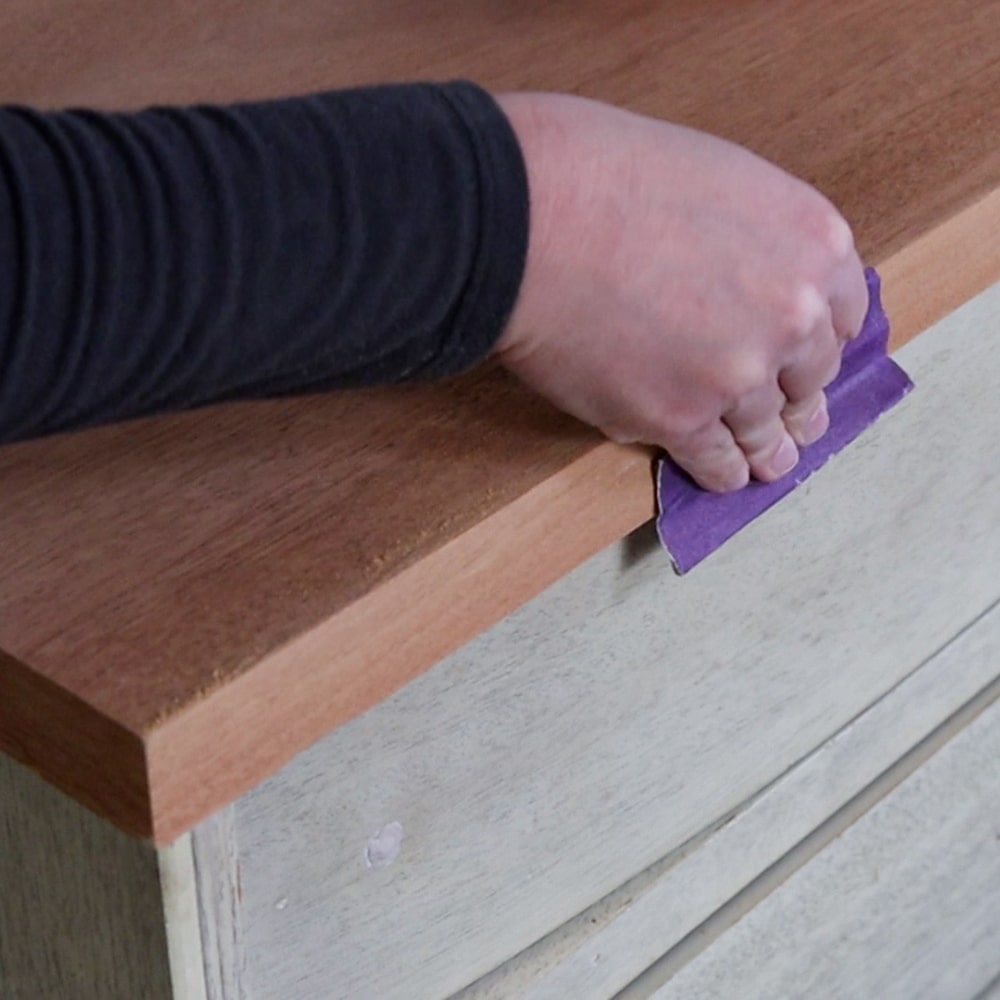 sanding furniture top with fine grit sandpaper