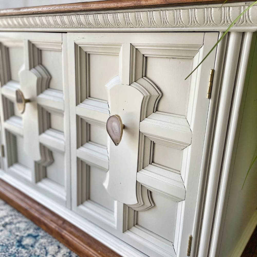 white painted buffet with geo knobs