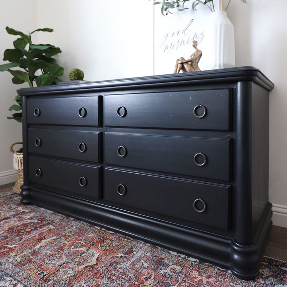 photo of a milk painted black furniture