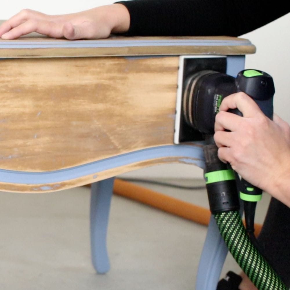 rectangle sander sanding the side and edge of the furniture