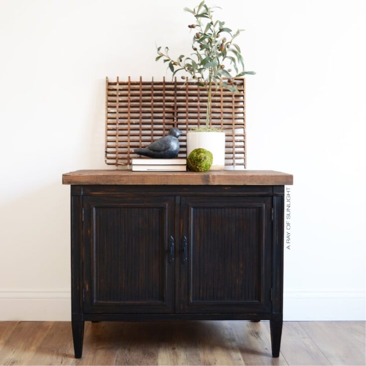 black painted cabinet with rustic wood top