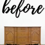 A vintage wooden dresser on wheels with “before” written in large script above it.