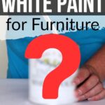 A hand painting furniture white, with a large red question mark over a paint can.
