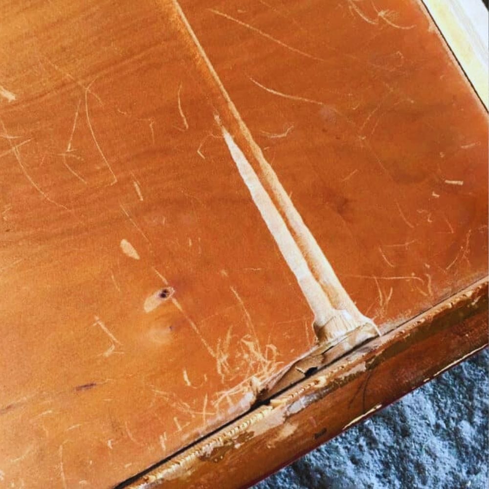 drawer showing damaged bottom that needs replacement