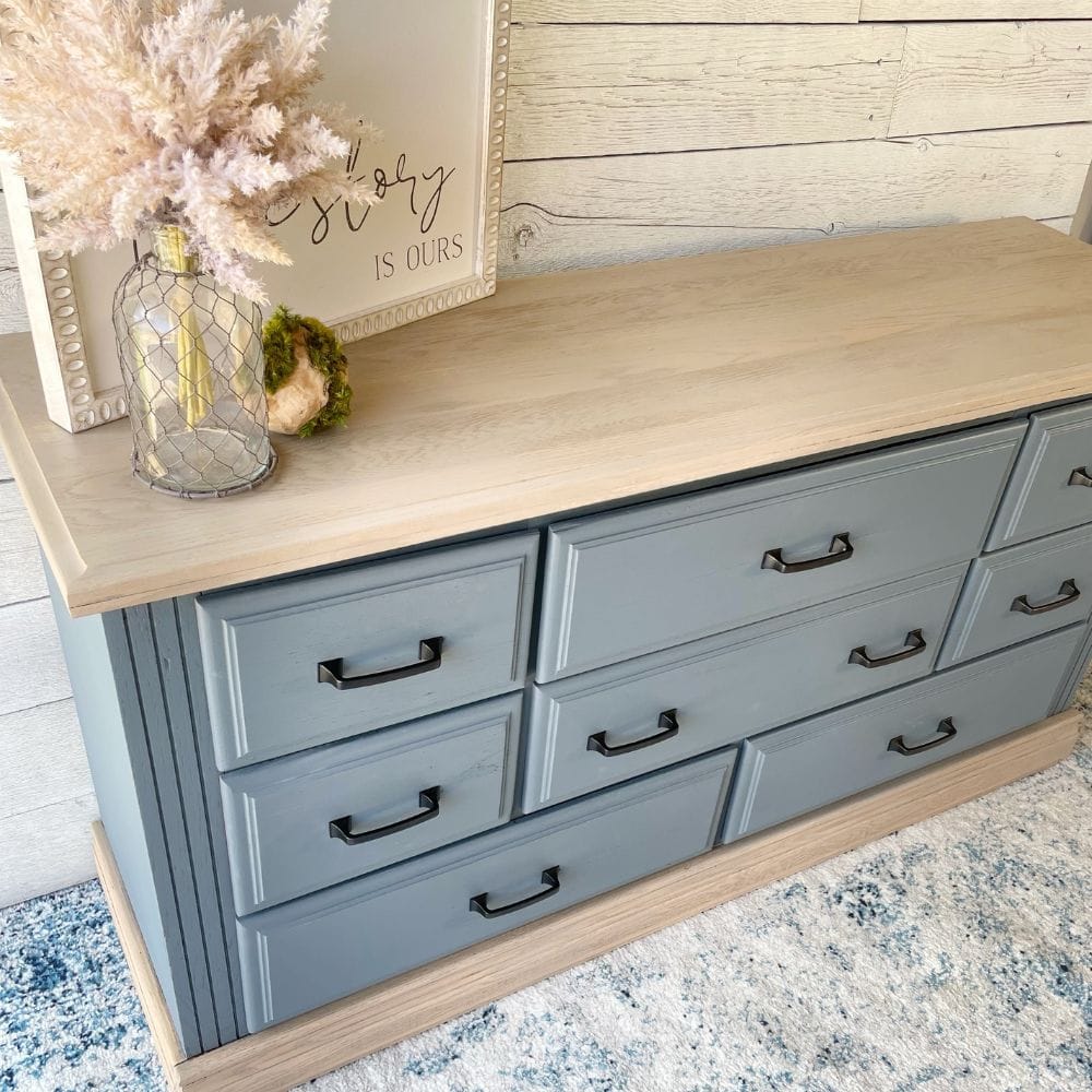 blue grey painted dresser with two toned wood look on bottom and top