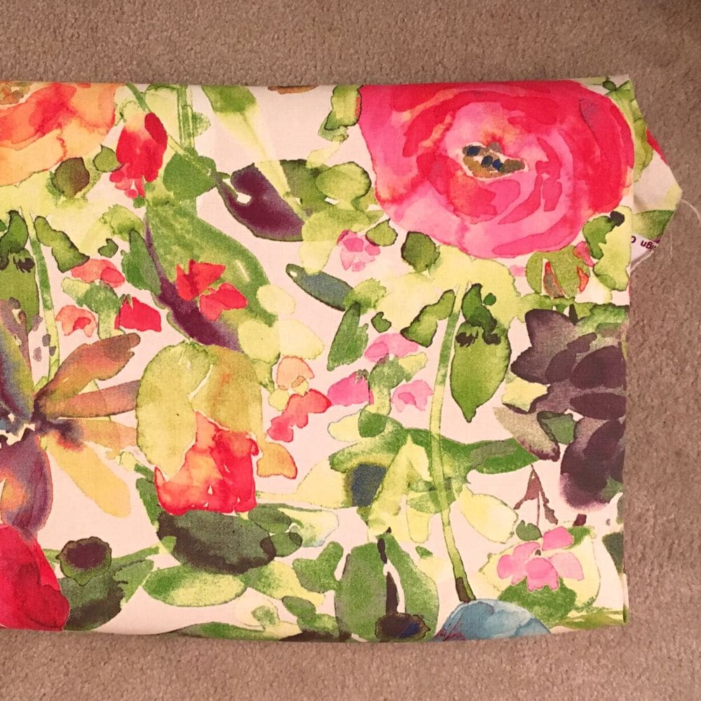 photo of floral pattern fabric to replace old fabric on bench
