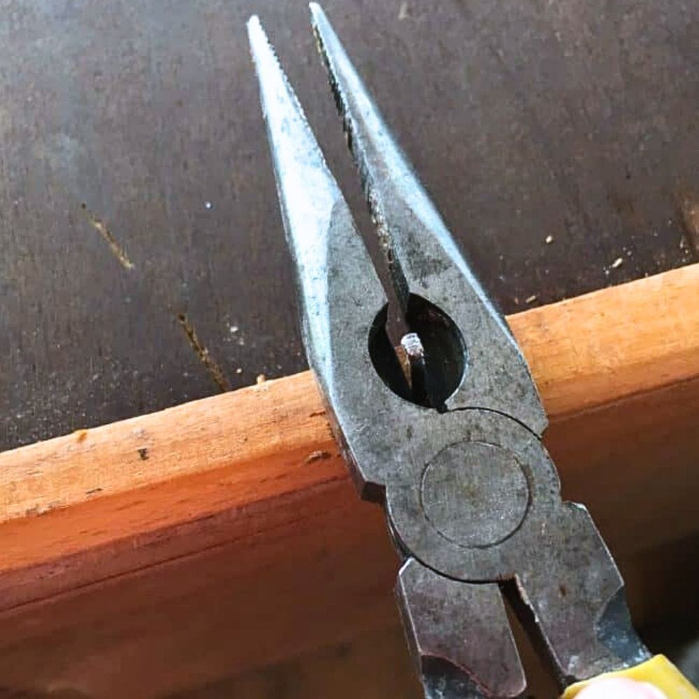 removing nails that stick out of the drawer