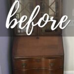 A vintage wooden secretary desk with glass doors, labeled before in large script text.