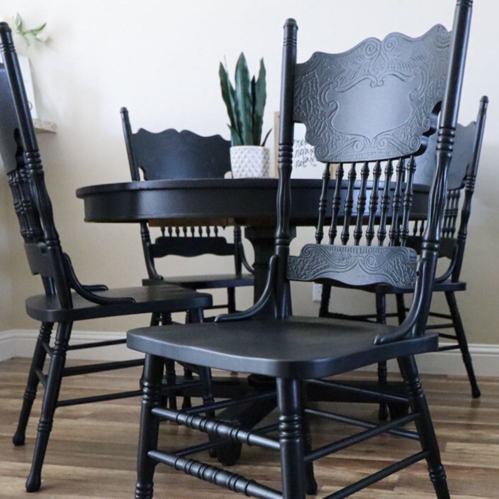 close up view of black painted chair and table