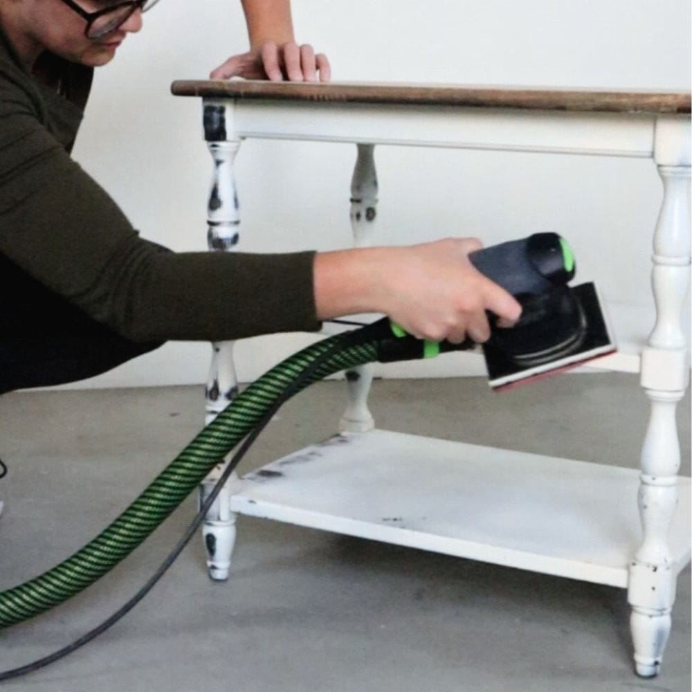 photo of Festool RTS 400 REQ Sander removing paint from furniture