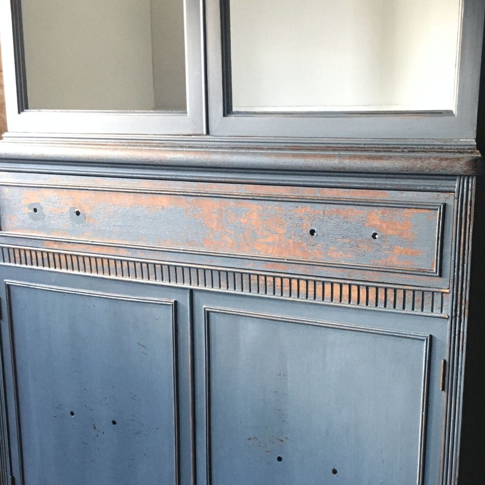 photo of a chippy blue finish after sanding