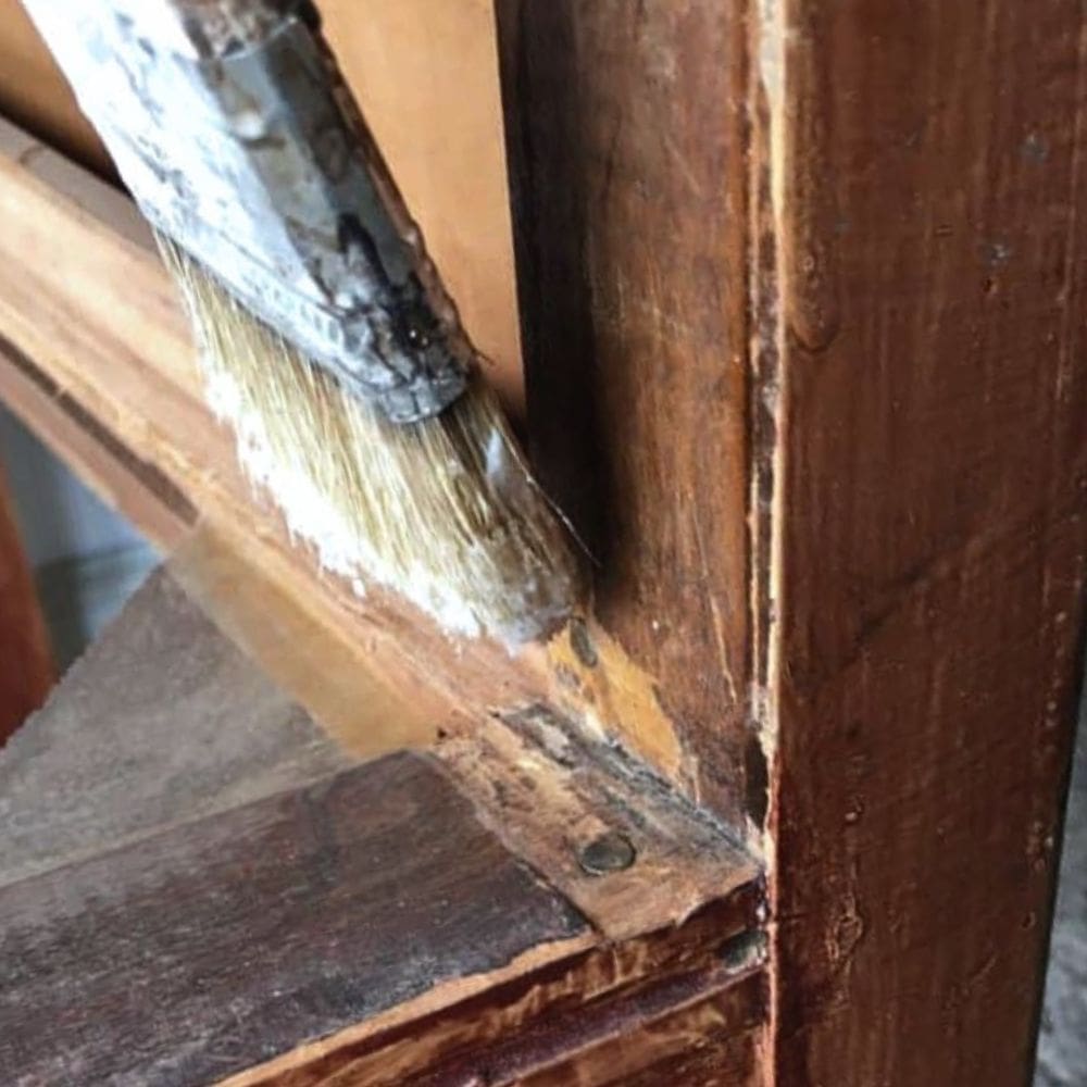 photo of applying wax to drawer track