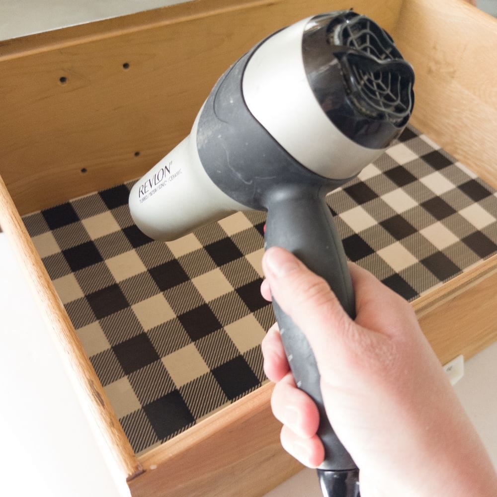 photo of removing contact paper with a hair blower