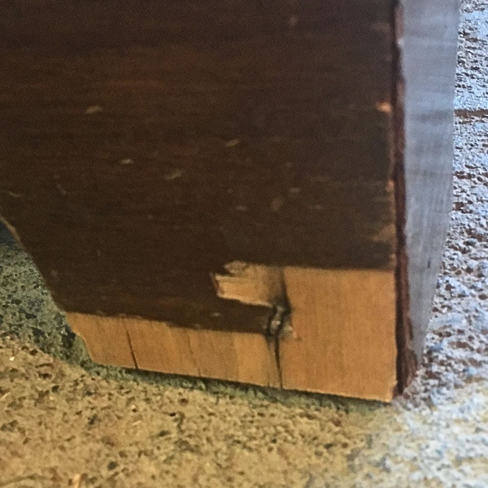 photo showing water damage to the bottom of furniture