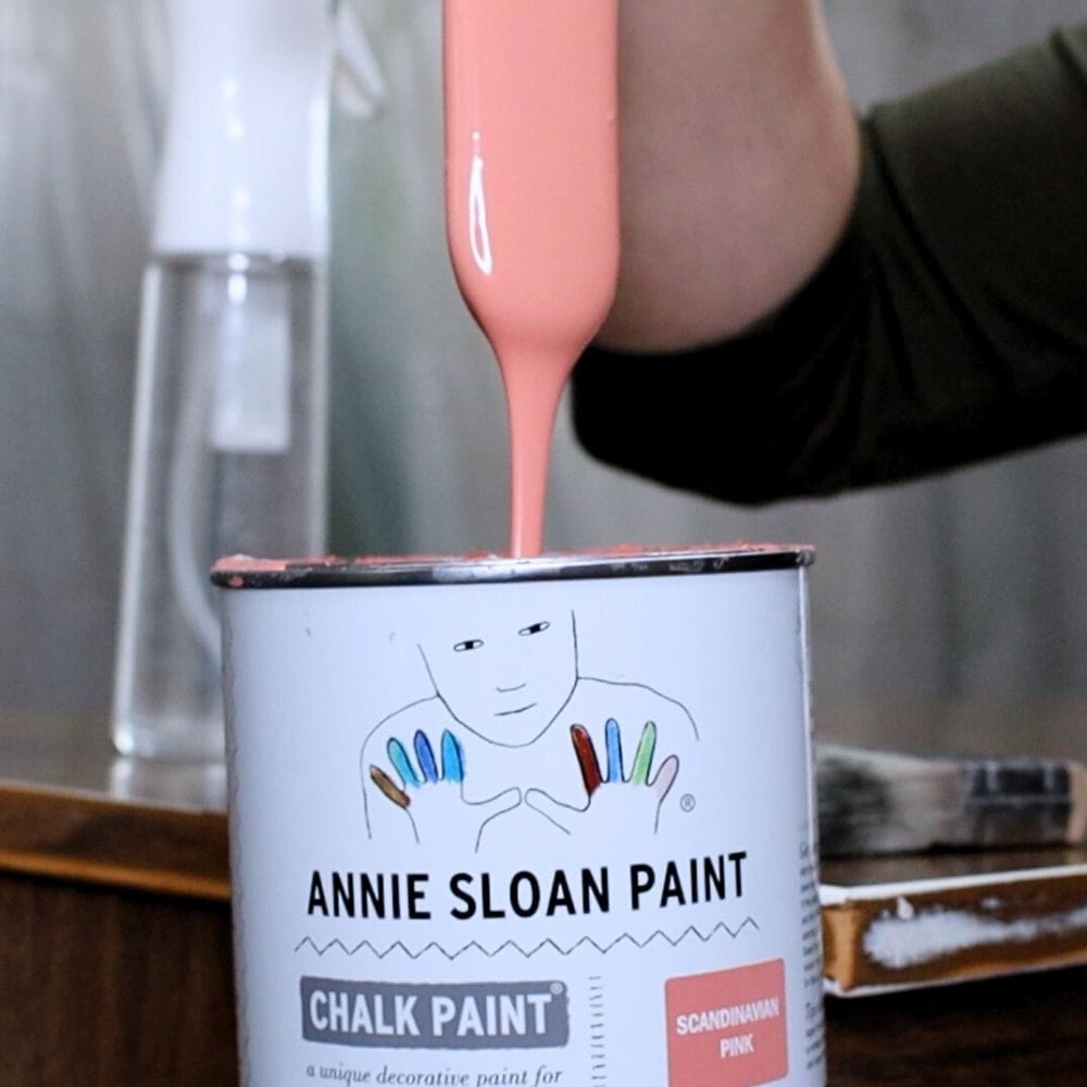 stirring annie sloan chalk paint before painting