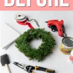 Supplies for a wreath craft, including greenery, ribbon, glue gun, pliers, foam brush, and wood stain.