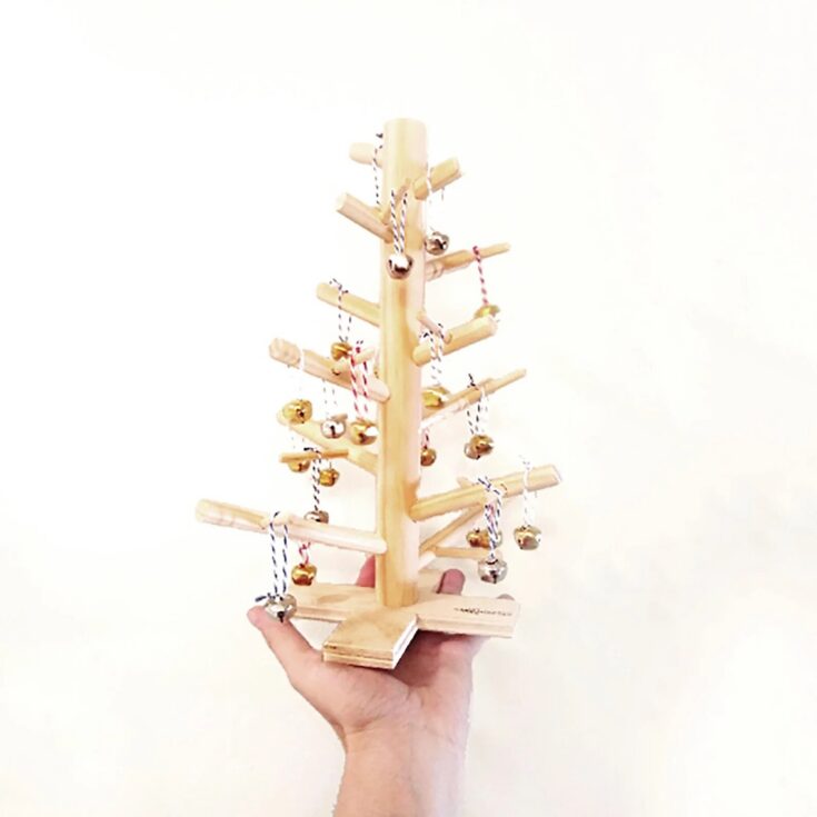 This unique and modern Christmas tree is for those who prefer a minimalist and Scandinavian style in their home decor. It's made out of hardwood dowels and has several branches for you to decorate with small ornaments.