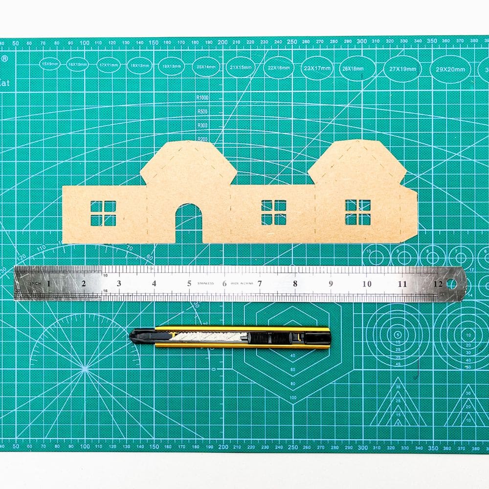 cut and score house template using a craft cutter and metal ruler