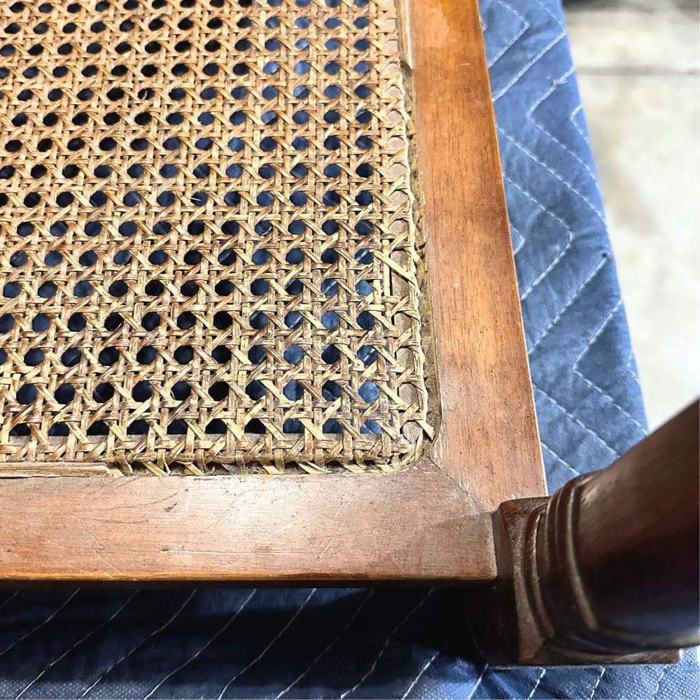 photo of a cane furniture with damaged reeding