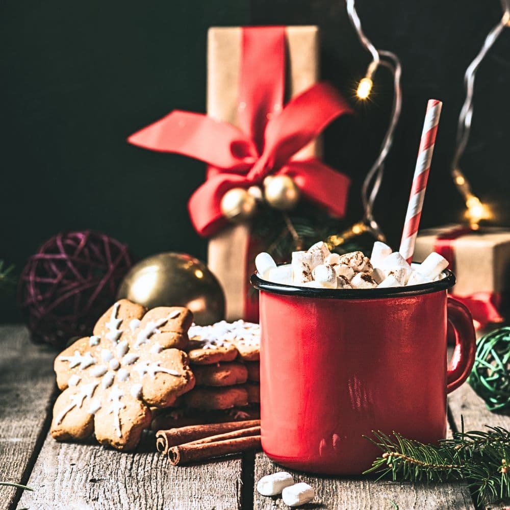 photo of a chocolate drink with Christmas cookies