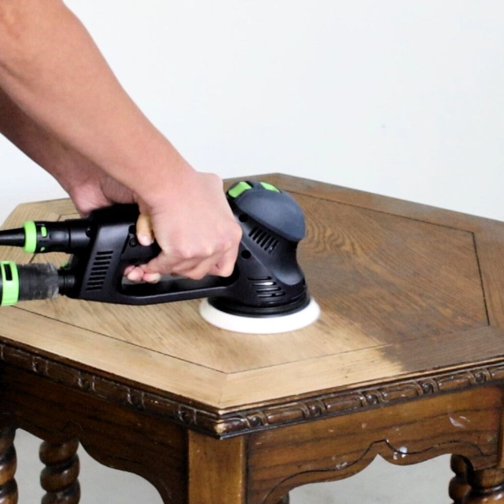 Sanding furniture before painting with a sander