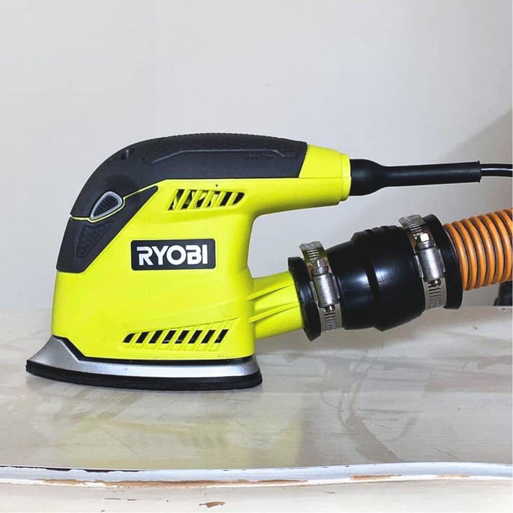 ryobi detail sander attached to shop vac hose with adapter