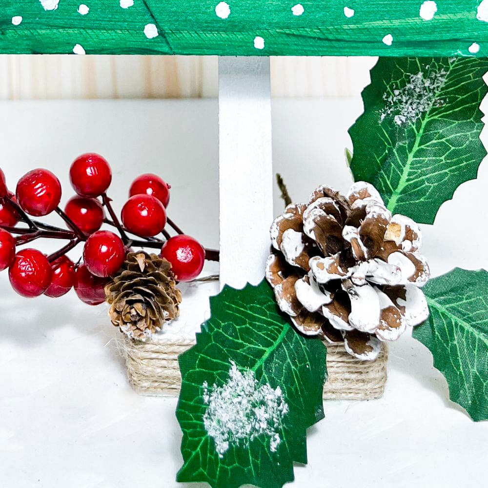 close up photo of added decors for wooden Christmas tree 