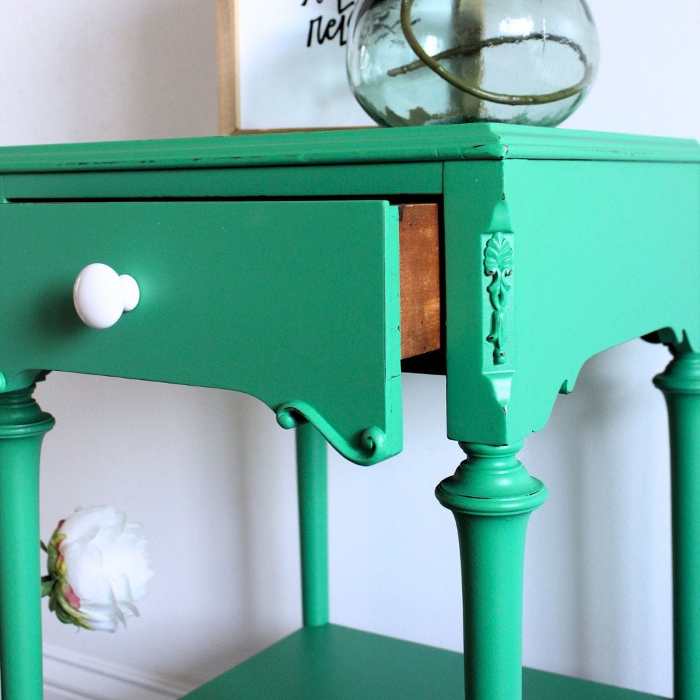 close-up photo of emerald green bedside table after the makeover 