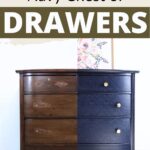 A wooden chest of drawers, half unpainted and half painted navy blue,