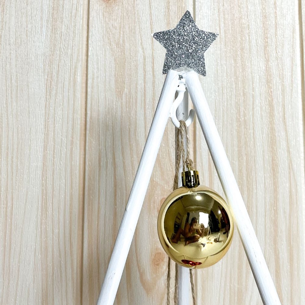 photo of added decoration to dowel christmas tree