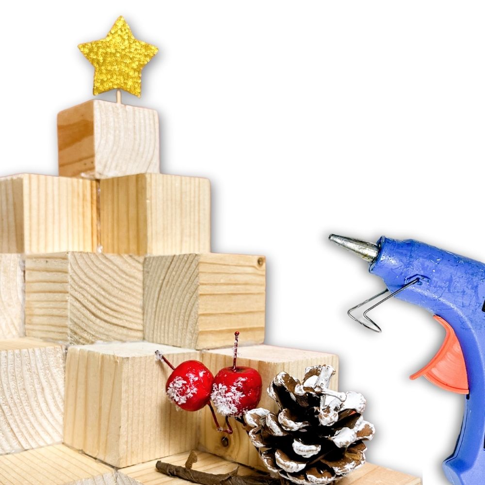 photo of adding Christmas ornaments using a glue gun