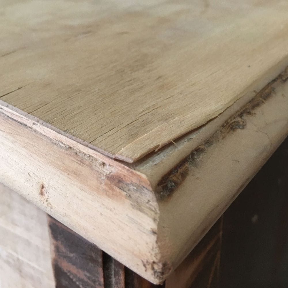 photo of chipping veneer on furniture