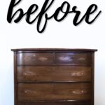 A scratched and worn wooden dresser