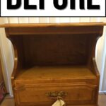 A wooden nightstand with a drawer before makeover