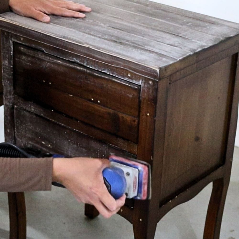 Photo of sanding furniture with a power sander