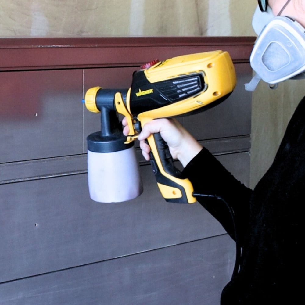 Photo of spraying paint onto dresser using wagner paint sprayer