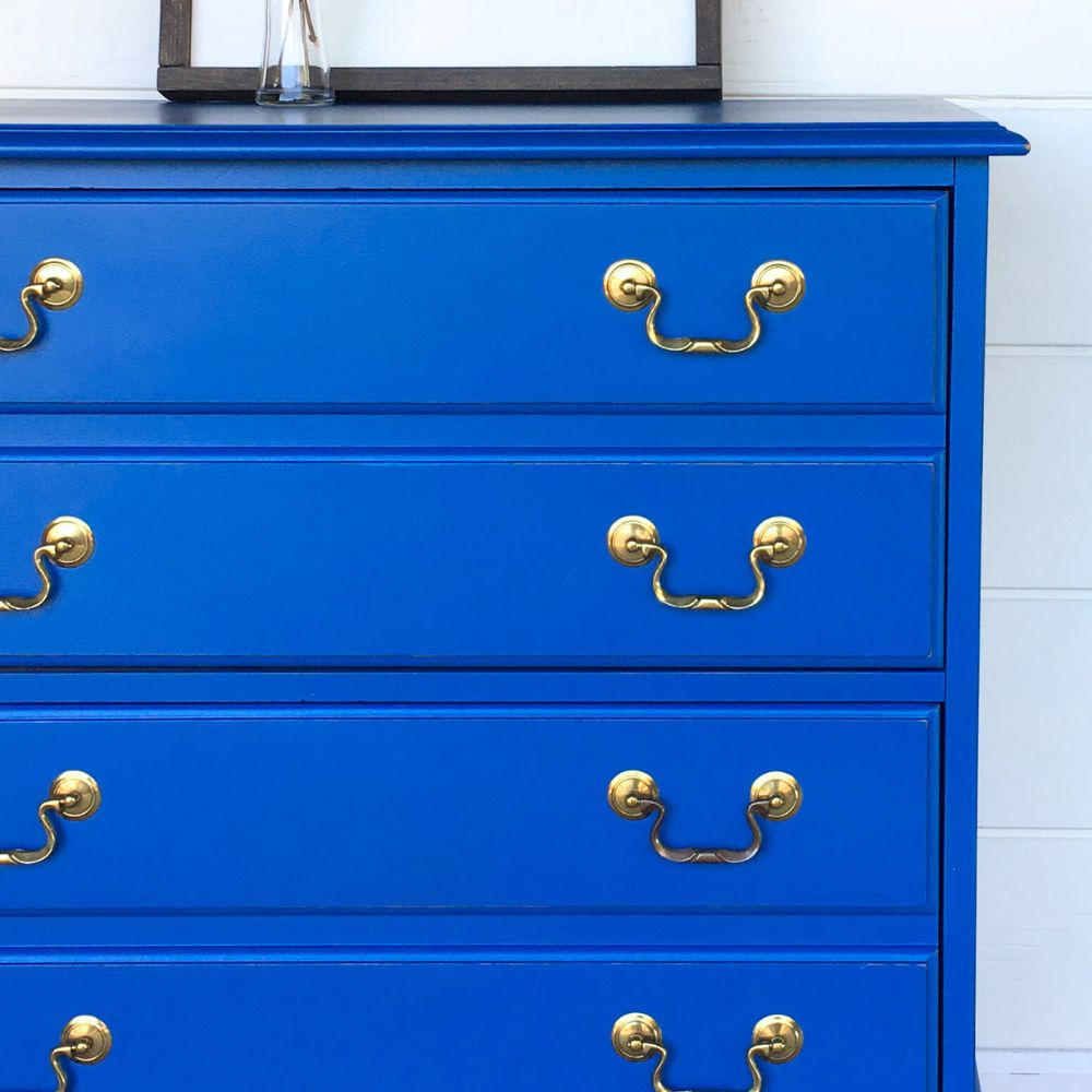 close-up photo of Blue Nursery Dresser with gold hardware