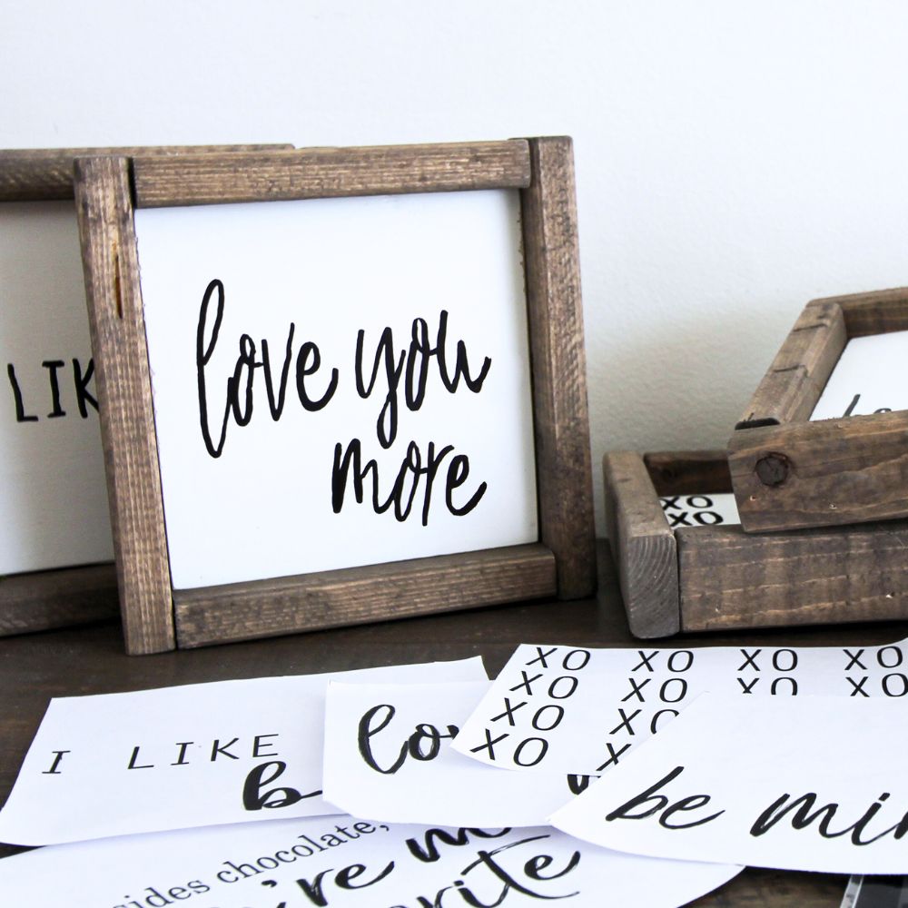photo of love you more wooden sign