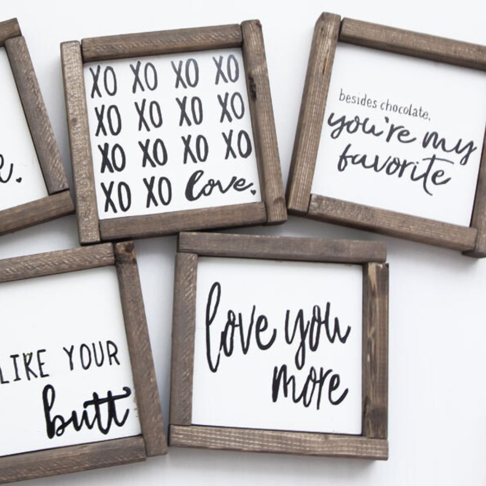 photo of I love you more wooden sign together with other mini signs
