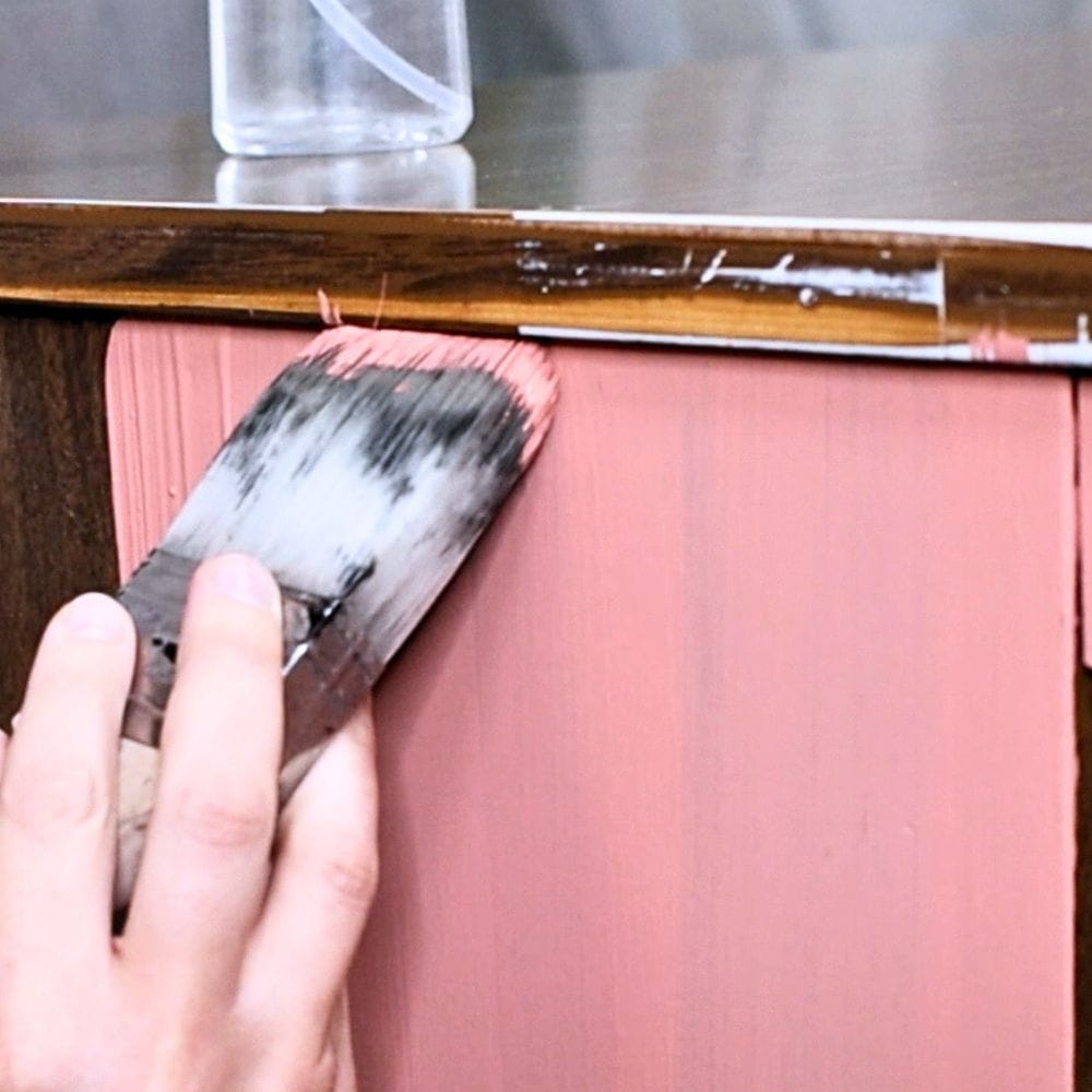 photo of painting wooden furniture using good quality brush